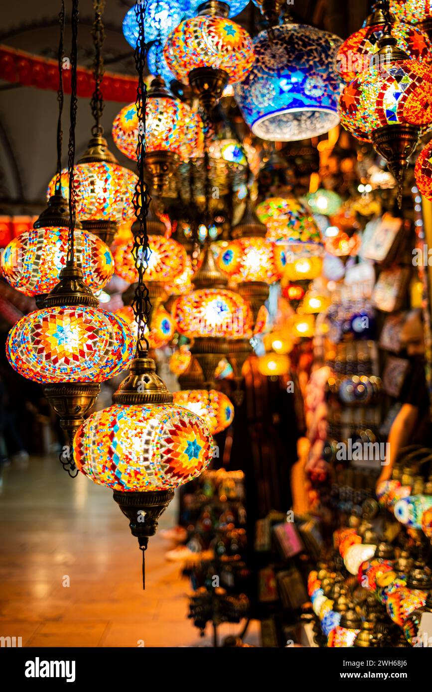 Bask in the enchanting glow of vibrant lanterns in the bazaar, a magical display of traditional crafts, handmade treasures. Stock Photo