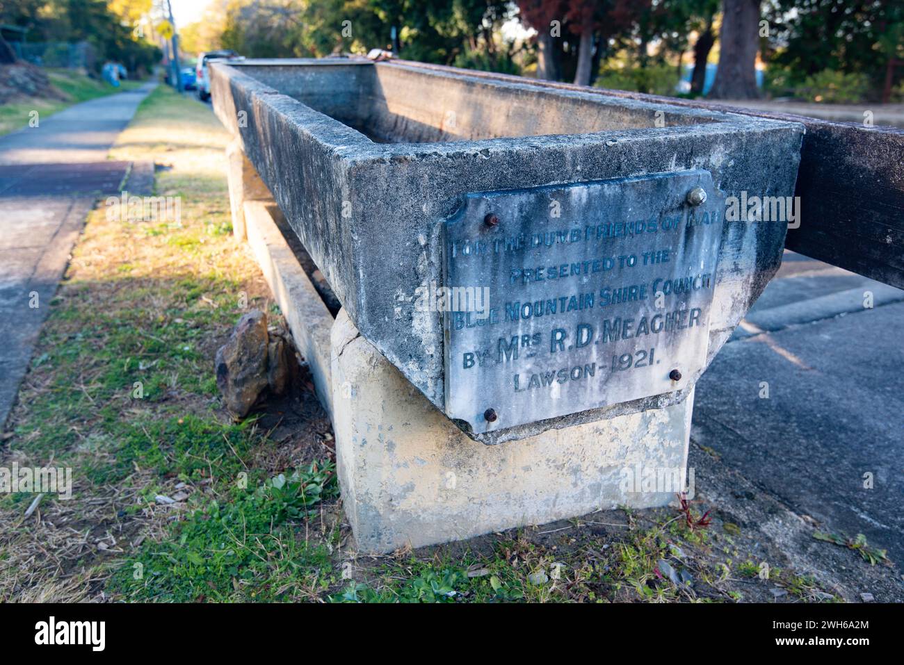 An antique horse water trough beside the road in the Blue Mountains town of Lawson, New South Wales, Australia. Donated in 1921 by Mrs R.D. Meagher Stock Photo