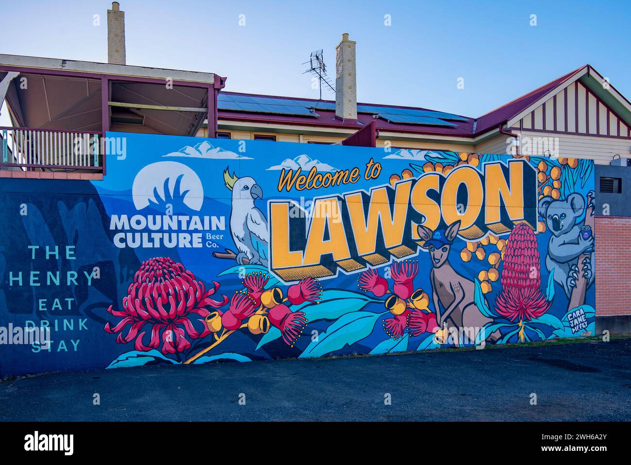 A large mural sized billboard welcomes people to the town of Lawson and promotes a local brewery, in the Blue Mountains, New South Wales, Australia Stock Photo