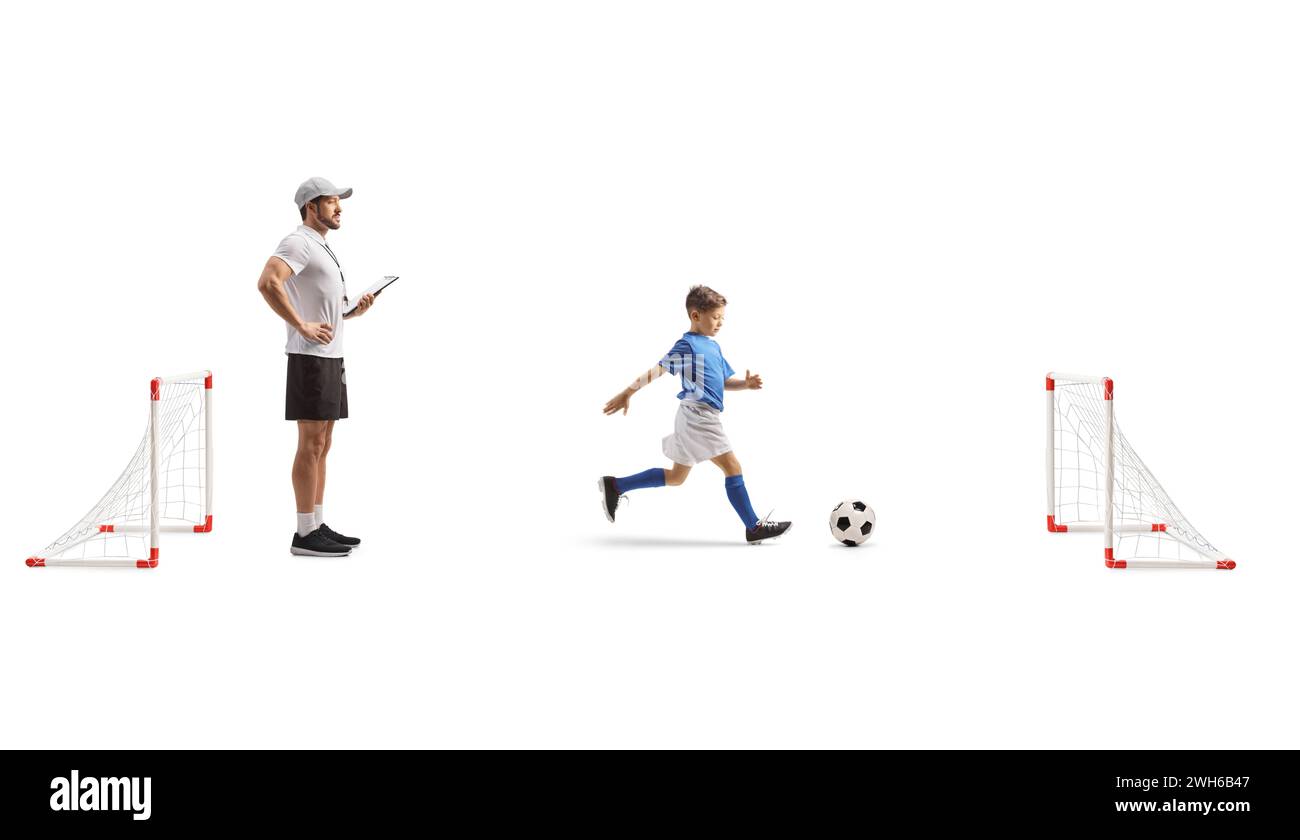 Boy with a coach at football training isolated on white background
