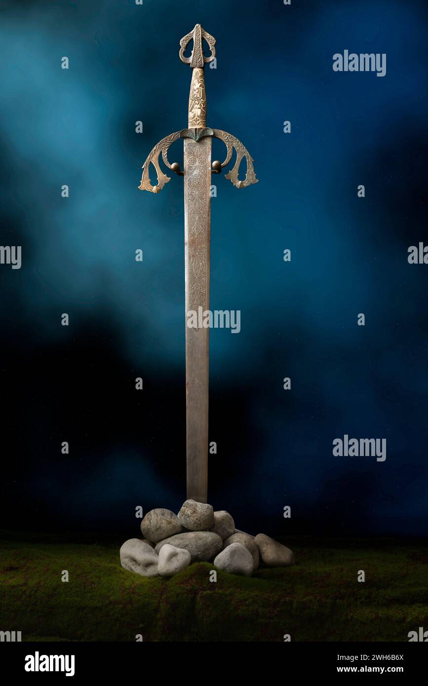 Antique medieval knight's sword standing against a romantic backdrop Stock Photo