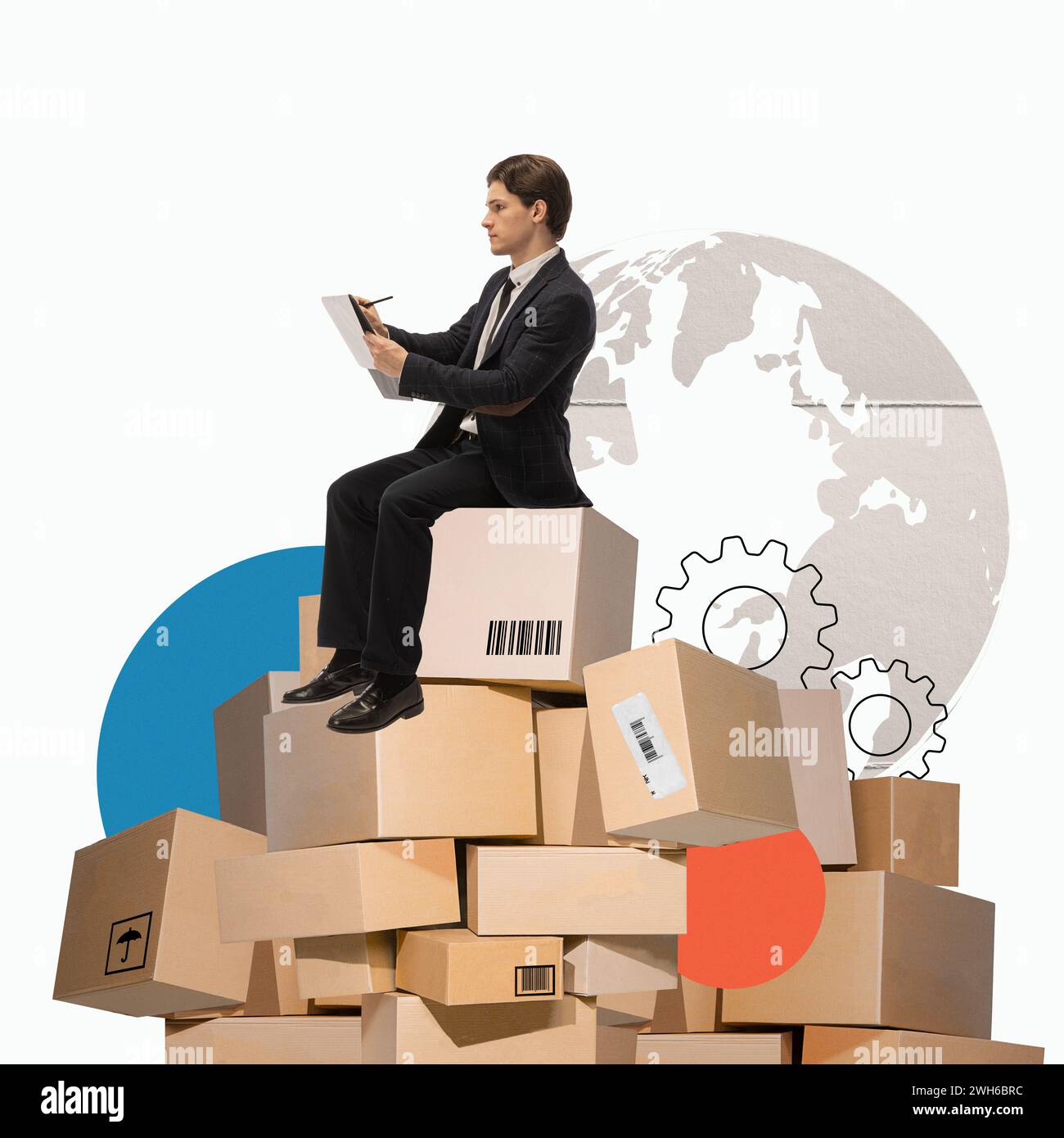 Man sitting on cardboard boxes and making notes over world map background. Global distribution. Creative modern design. Stock Photo