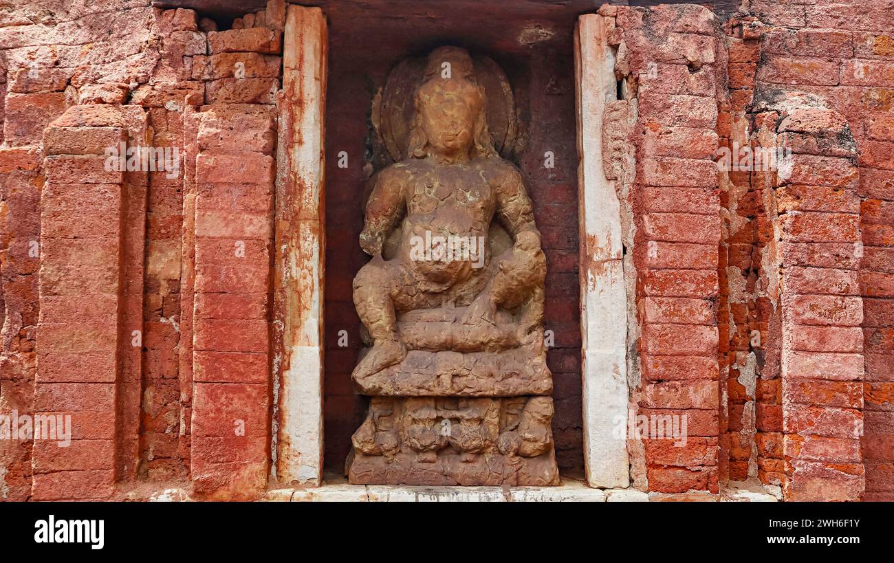 Ancient Sculpture of Buddhist Deity in the Anandprabhkuti Vihar, Sirpur, Mahasamund, Chhattisgarh, India. Stock Photo