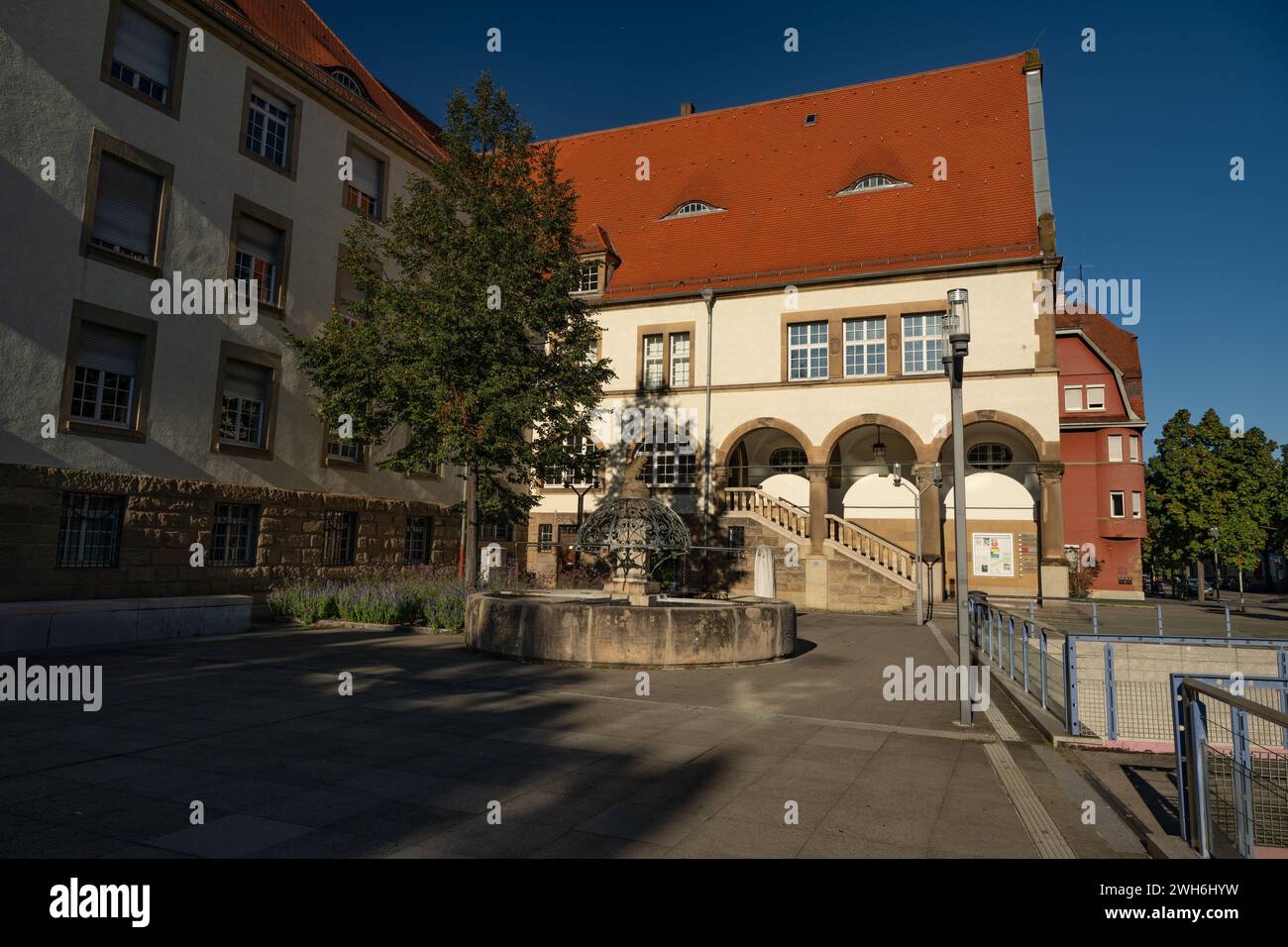 Historic fountain at the town hall in Feuerbach, a district of Stuttgart.  In the picture: Square in front of the town hall, beaver fountain and town Stock Photo