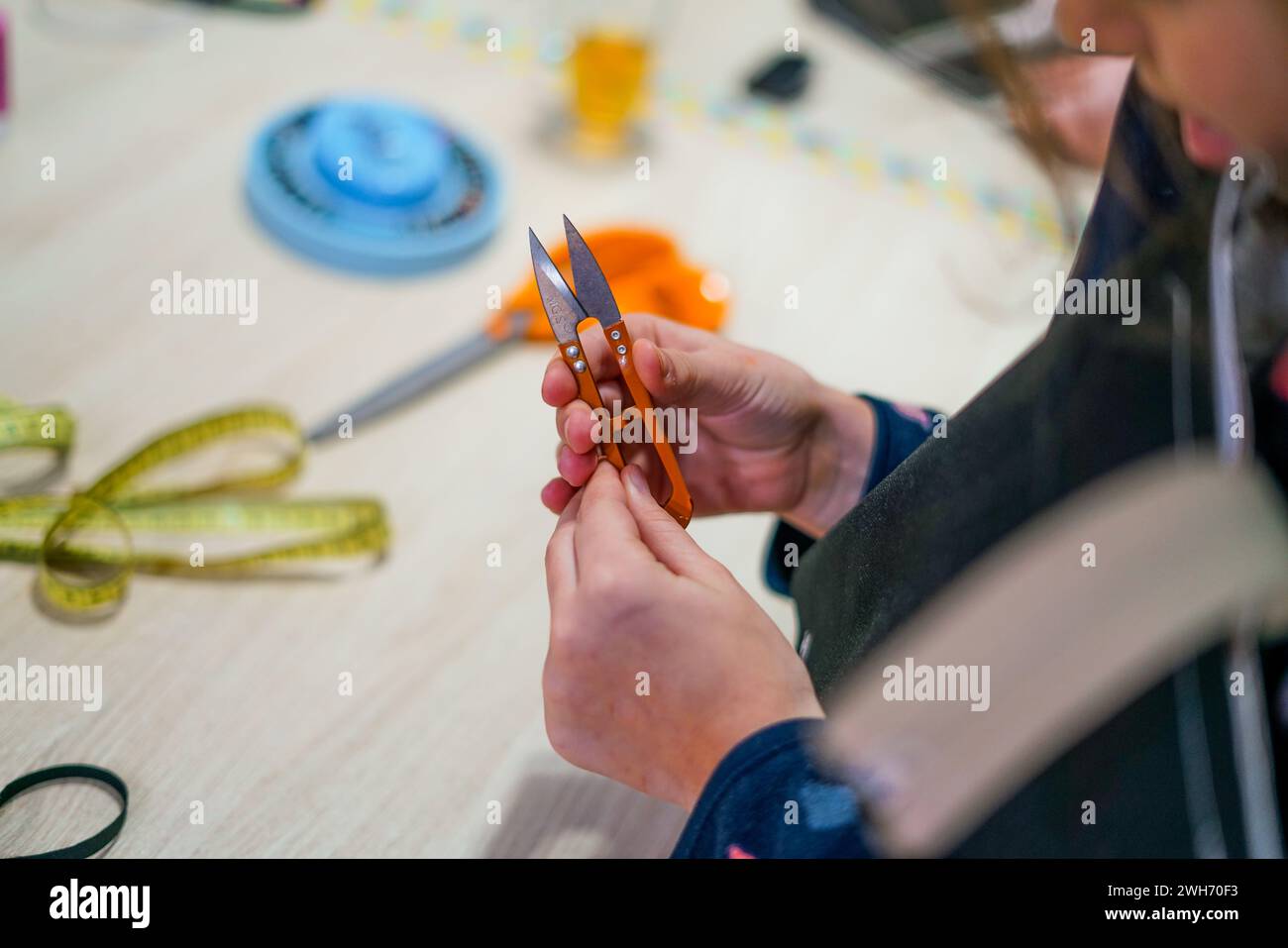 Measuring tape and scissors in the tailor shop Stock Photo - Alamy
