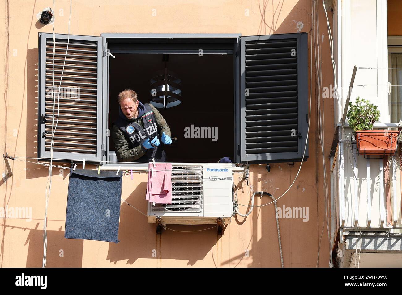 08th Feb 2024, Naples, Italy. A man of scientific police in the apartment where a man first killed his wife, then shot from the window at the police, and then committed suicide, in the San Giovanni a Teduccio neighborhood in Naples. Credit: Marco Cantile/Alamy Live News Stock Photo