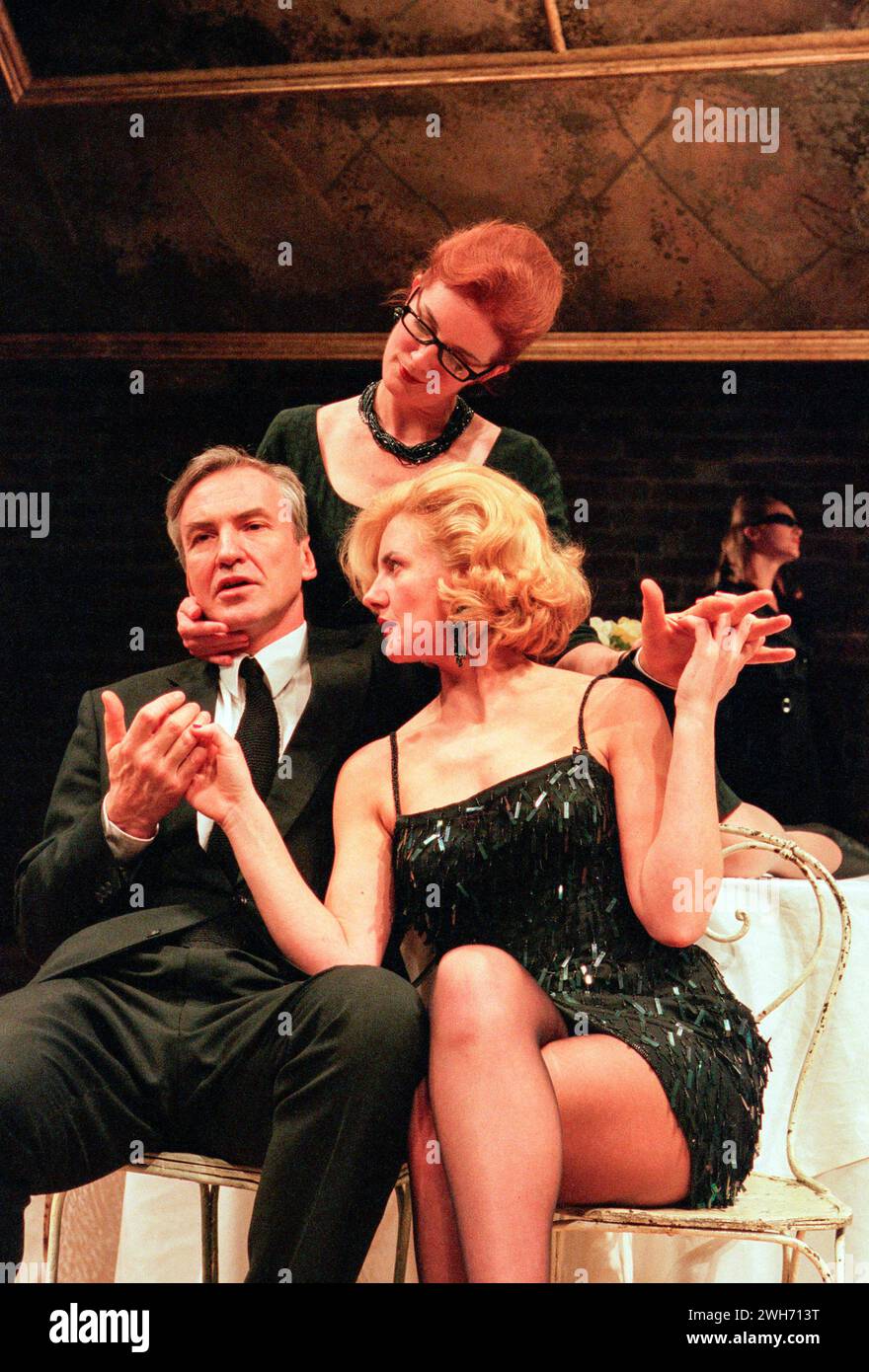 l-r: Larry Lamb (Guido Contini), Susannah Fellows (Luisa), Clare Burt (Carla) in NINE at the Donmar Warehouse, London WC2  11/12/1996  book: Arthur Kopit  music & lyrics: Maury Yeston  adapted from the Italian by Mario Fratti  design: Anthony Ward  lighting: Paul Pyant  choreographer: Jonathan Butterell  director: David Leveaux Stock Photo