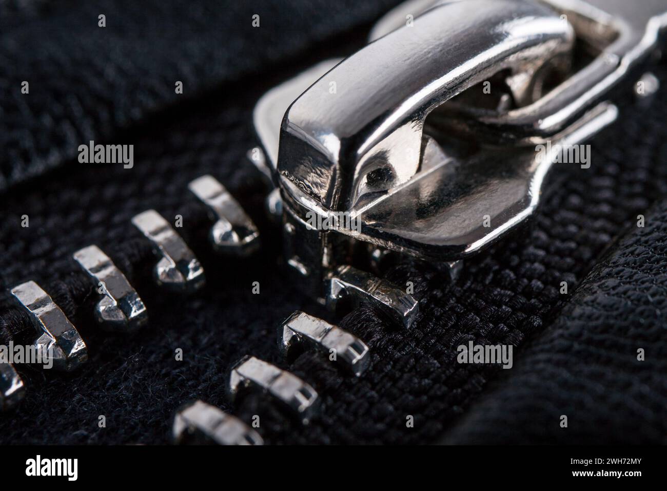 Close-up zipper on black clothes background, macro Stock Photo