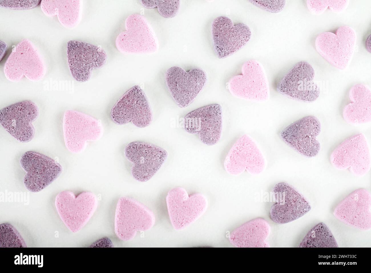 Colorful sugar sprinkles on white background Stock Photo