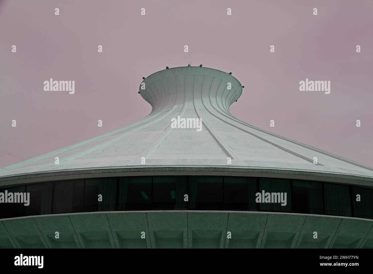 Futuristic rooftop with a bird that looks like a UFO Stock Photo