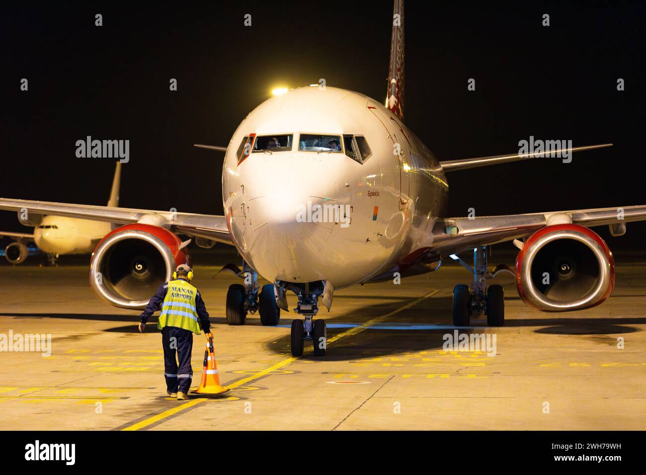 Bishkek, Kyrgyzstan - September 26, 2023: Rossiya Russian Airline plane at the Manas International Airport at night Stock Photo