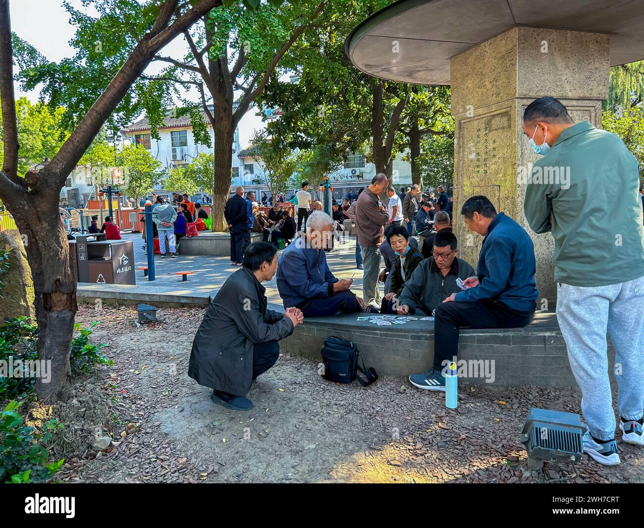 Suzhou, China, Chinese Tourists, Street Scenes, Large Crowd People, Men, Seniors sitting Playing Games on Town Square, senior social life, Retired, Stock Photo