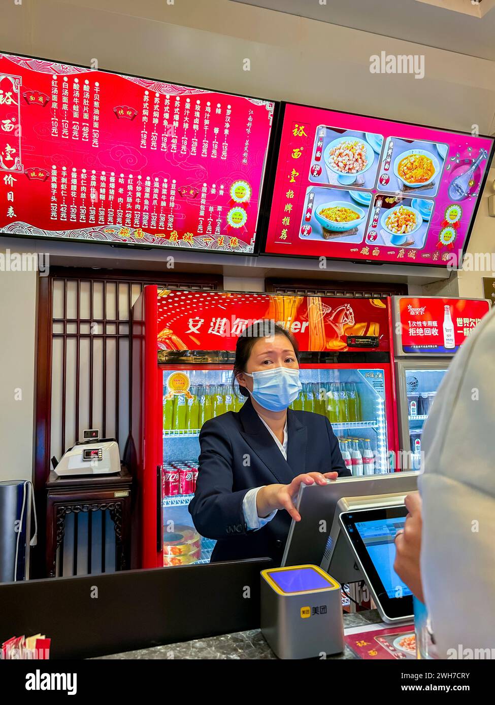 Suzhou, China, Chines Women Clerk Working in Local Chinese Restaurant, Counter, taking orders, Chinese Tourists, interior Stock Photo