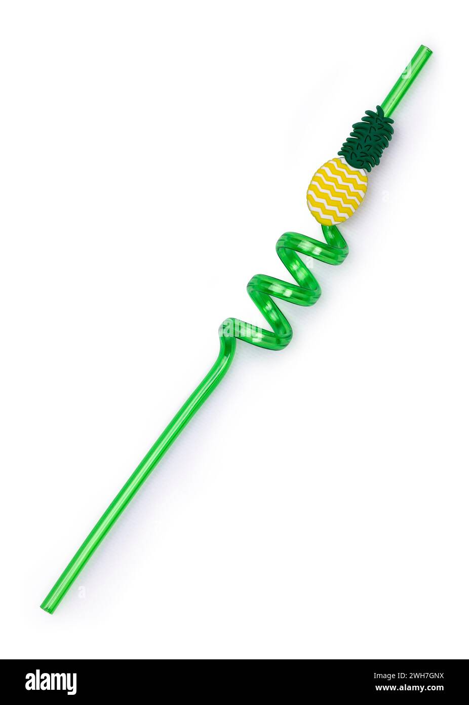 Green unused curly straw, top view. Isolated on a white background. Decorated with a pineapple. Stock Photo