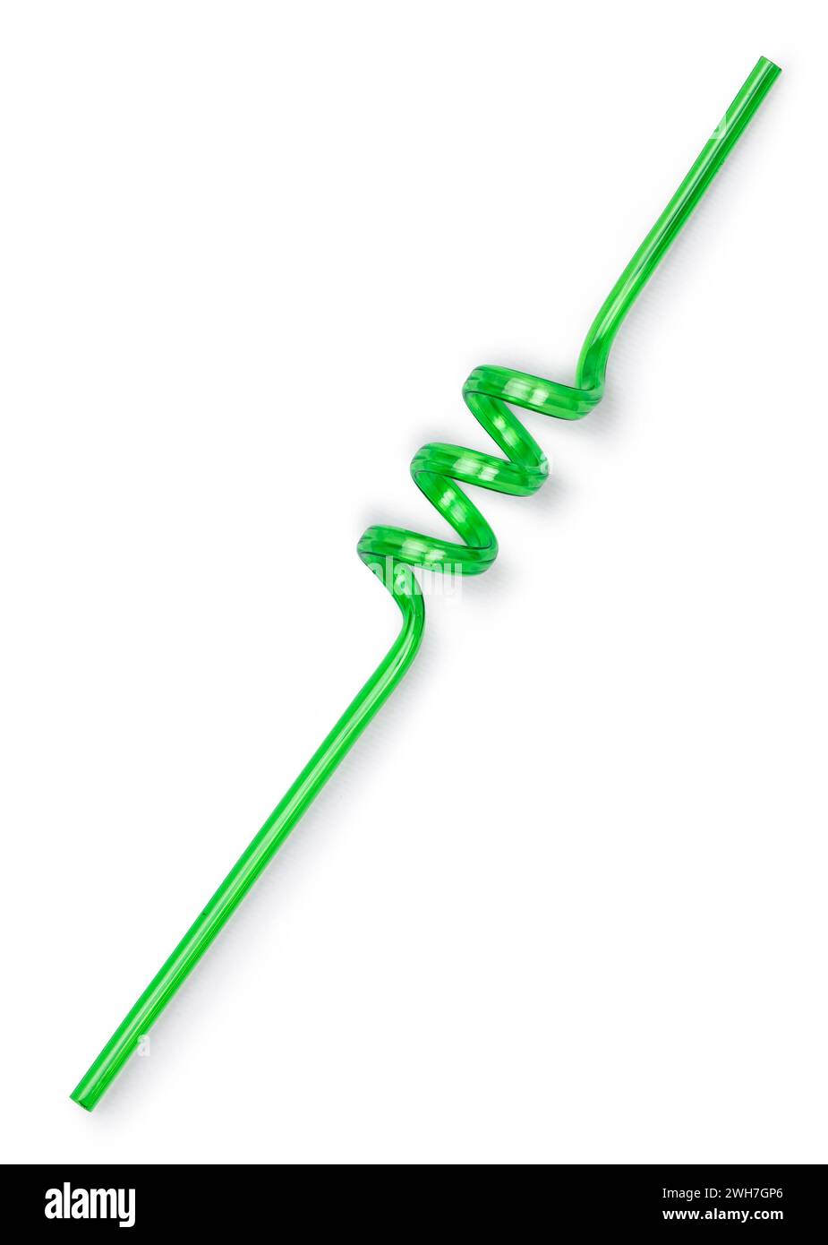Green unused curly straw, top view. Isolated on a white background. Stock Photo