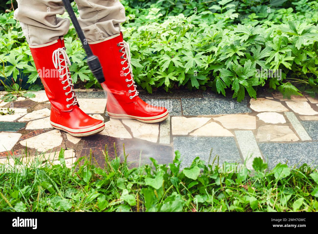 Washing mud off boots hires stock photography and images Alamy