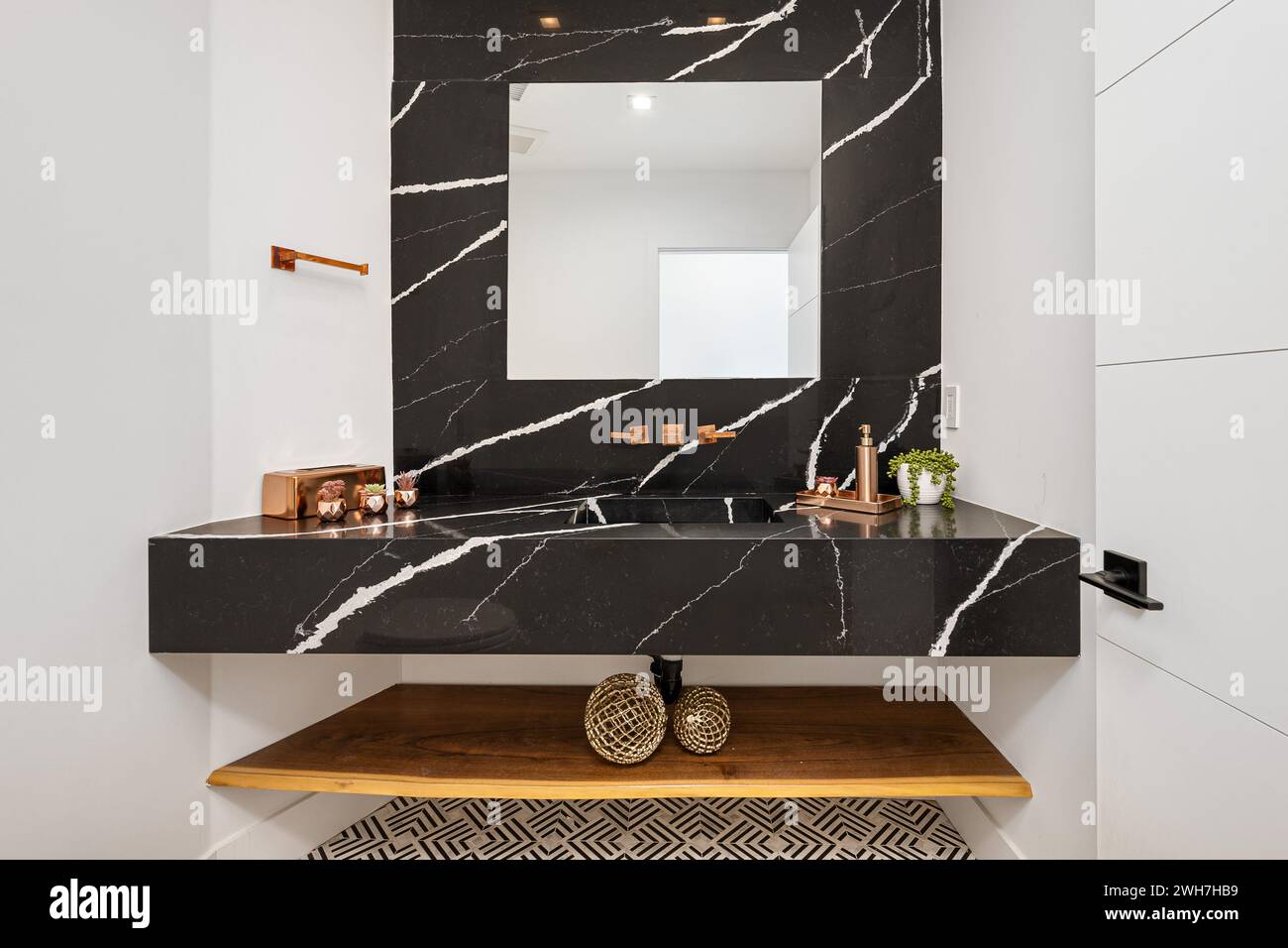 A mirror and vanity with shelf underneath on wall Stock Photo Alamy