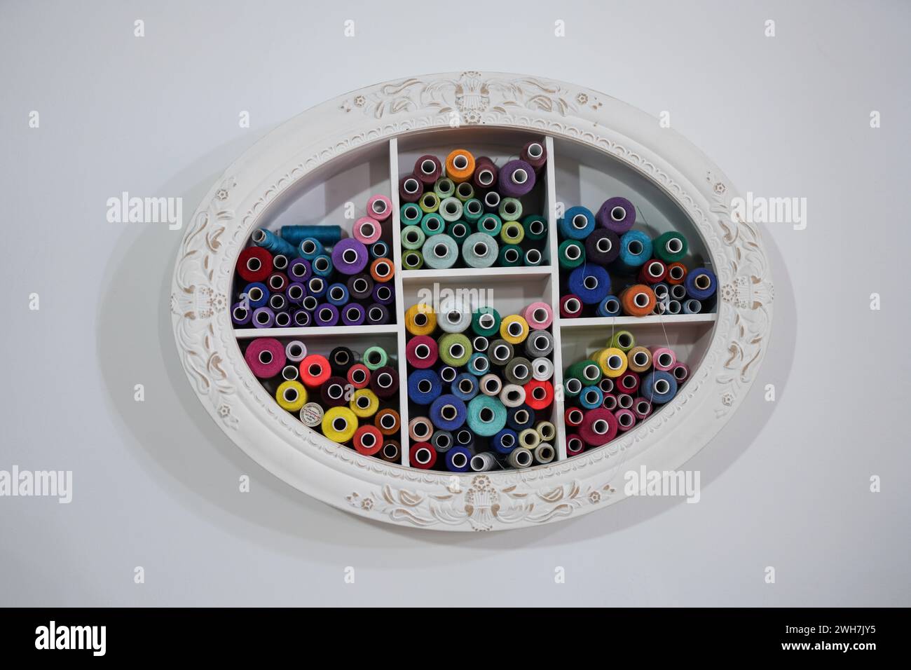 Colorful threads for sewing machine Stock Photo - Alamy