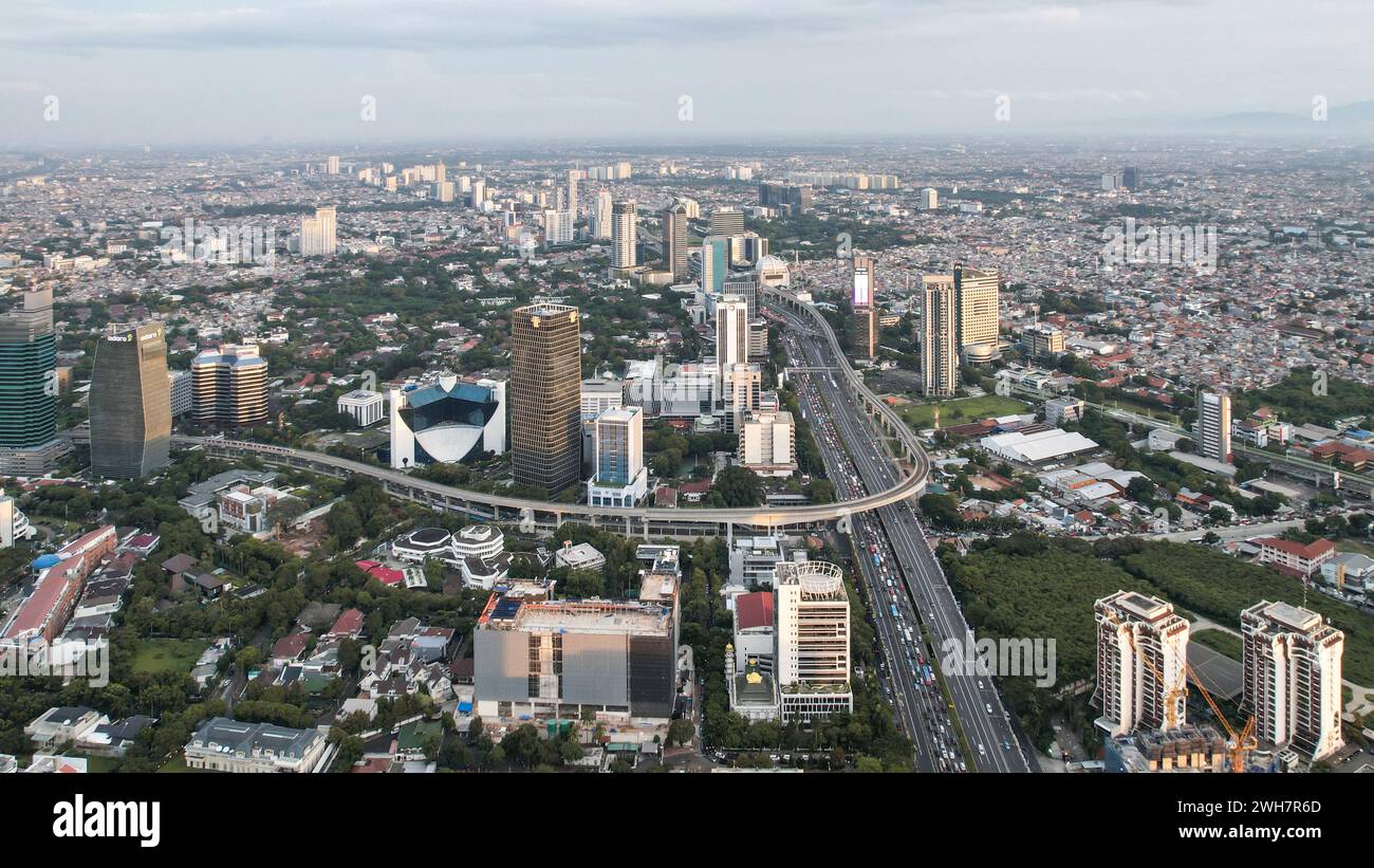 Panoramic cityscape of Indonesia capital city Jakarta at sunset. A rare ...