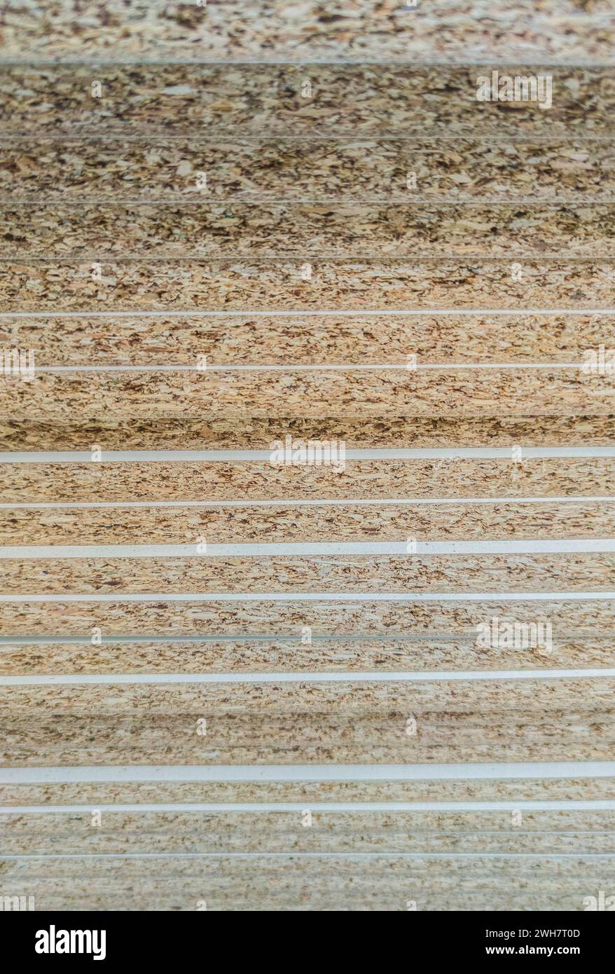 Veneer particle boards pilled on high. Edge details Stock Photo