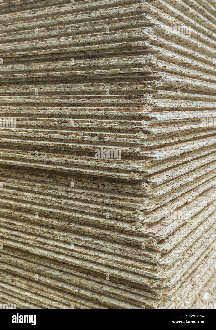 Particle boards pilled on high. Corner detail Stock Photo