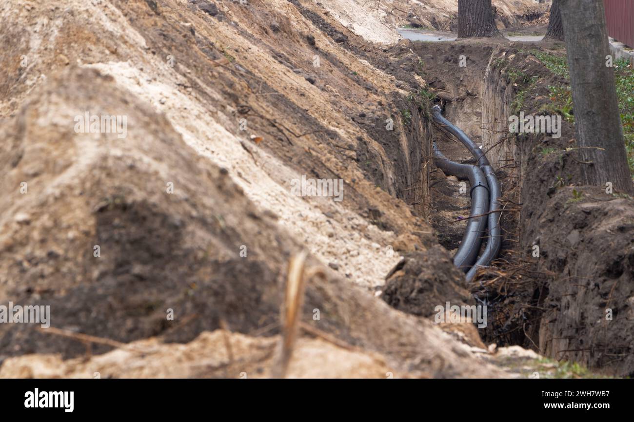 Black plastic pipes for underground water supply. PVC pipes. Sewer