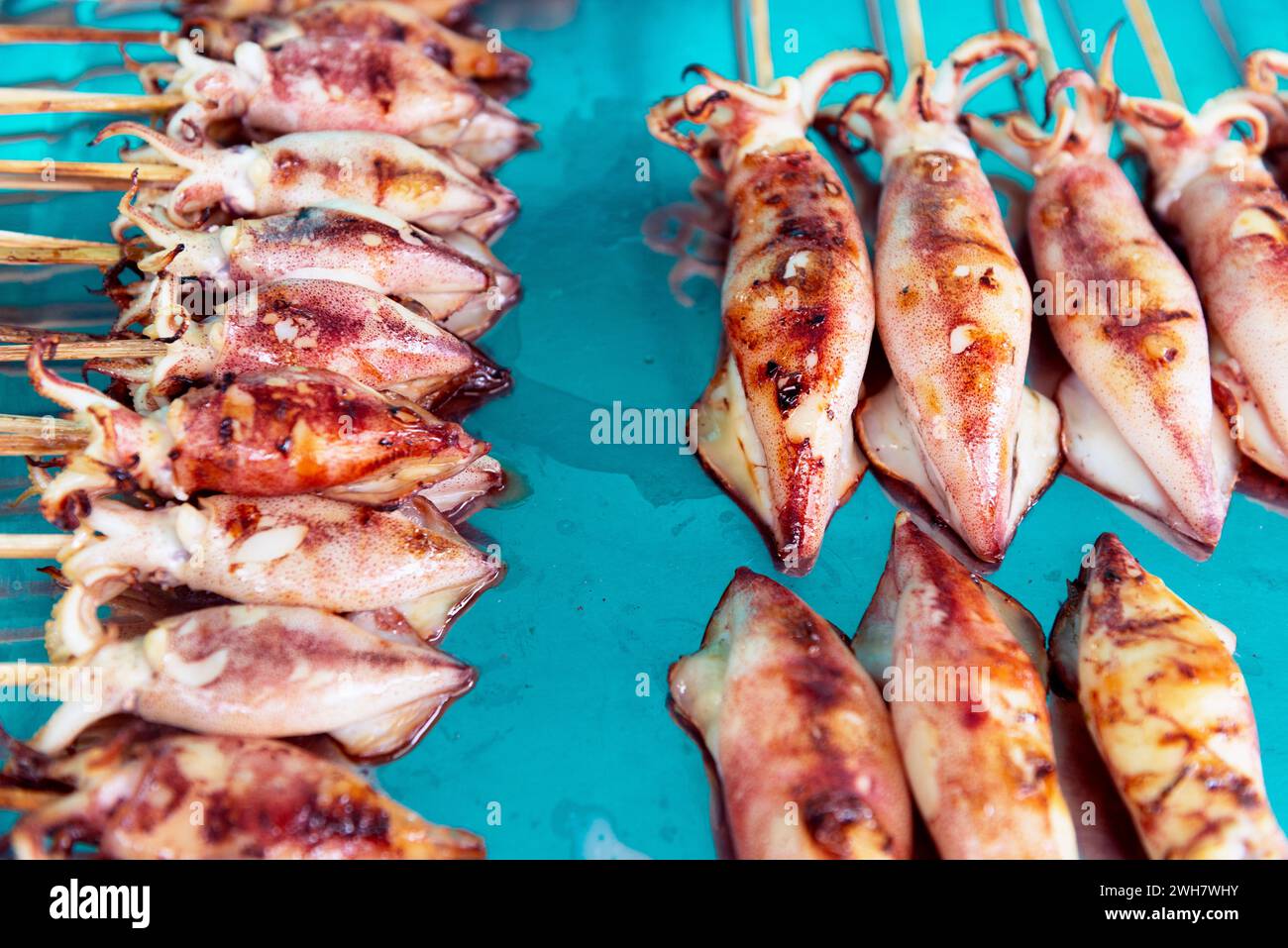 Grilled squid on stick Stock Photo
