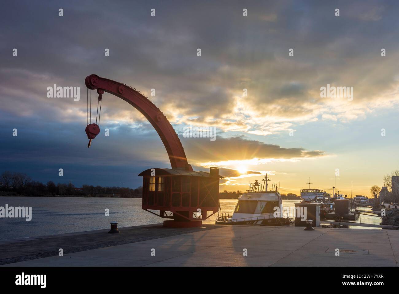 river Donau Danube at sunrise, old port crane, jetty Handelskai Vienna 02. Leopoldstadt Wien Austria Stock Photo