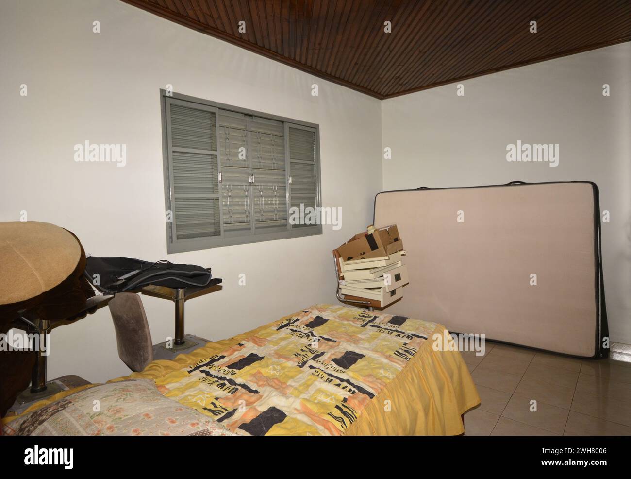 Residence room with : bed, chair, drawers and mattress, Brazil, South America Stock Photo