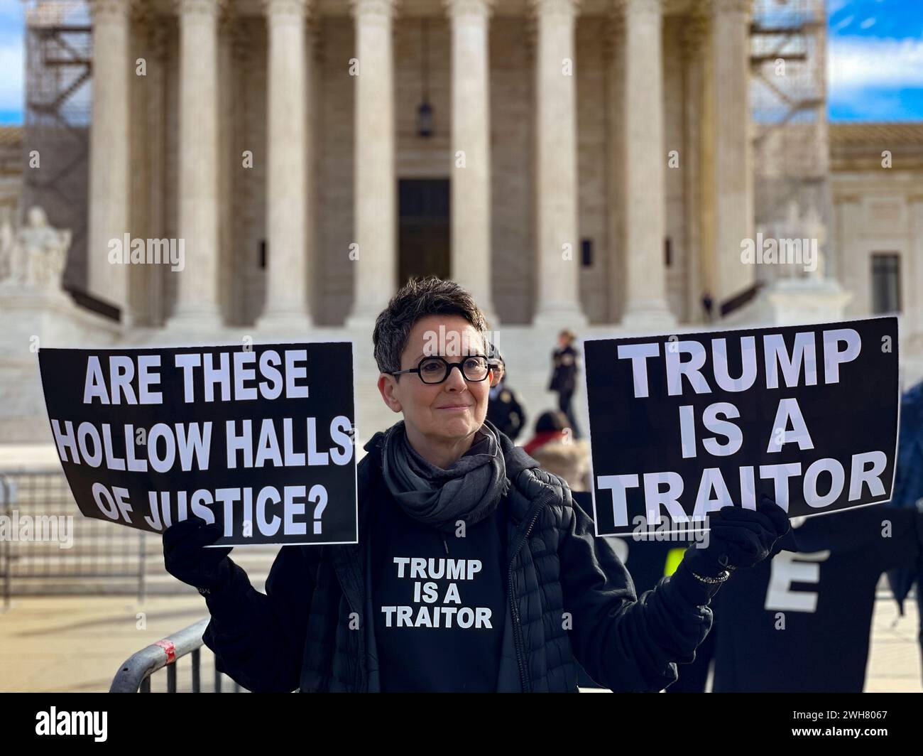 Washington, District Of Columbia, USA. 8th Feb, 2024. The Supreme Court hears oral arguments on whether former President Donald Trump can be kept off ColoradoÃs primary ballot due to his actions on January 6, 2021. JENNIFER HOBBS holds signs reminding the Court that Section 3 of the 14th Amendment prevents those who 'engaged in insurrection' from holding office. (Credit Image: © Sue Dorfman/ZUMA Press Wire) EDITORIAL USAGE ONLY! Not for Commercial USAGE! Stock Photo
