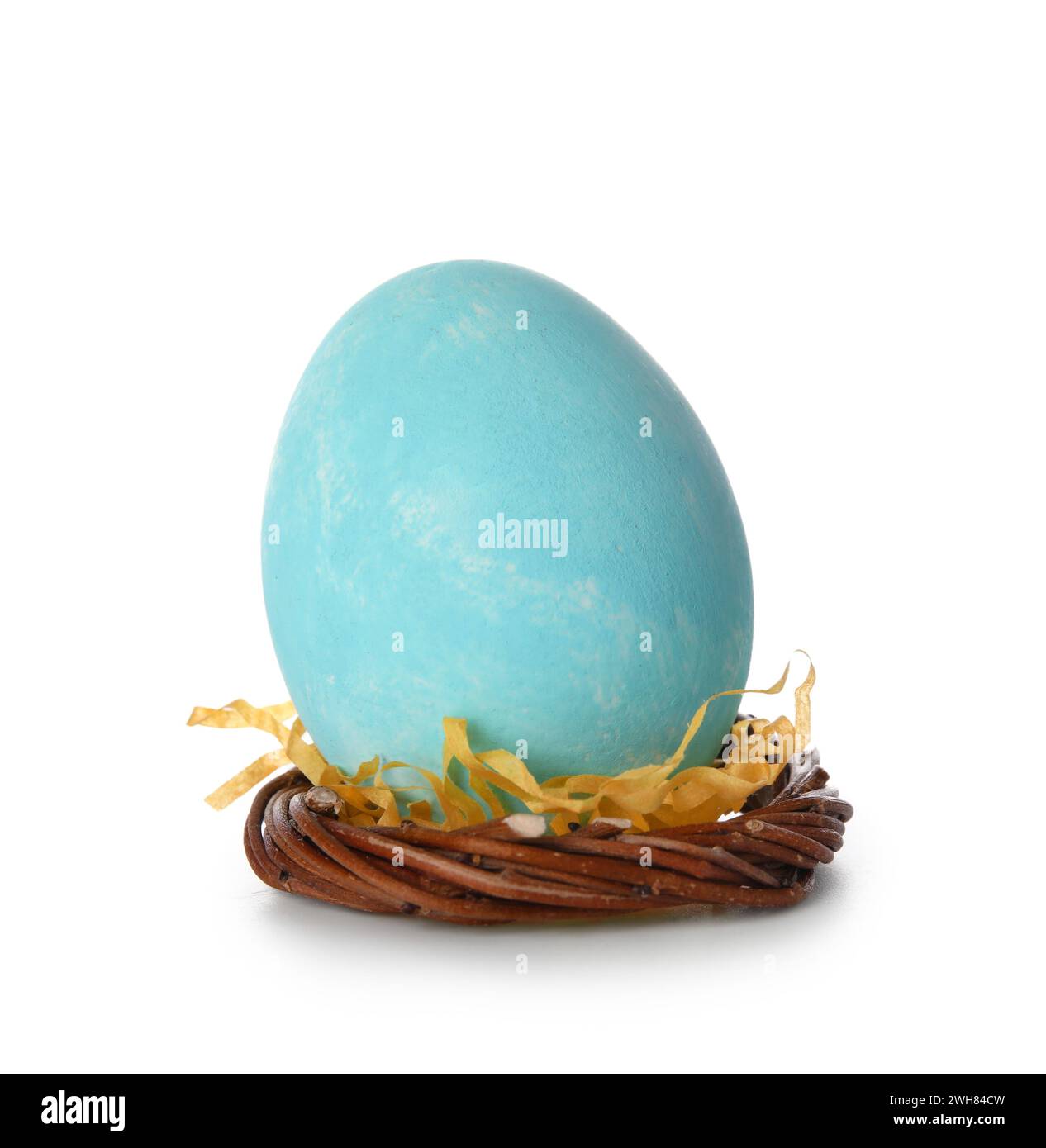 Blue Easter egg in nest on white background Stock Photo - Alamy