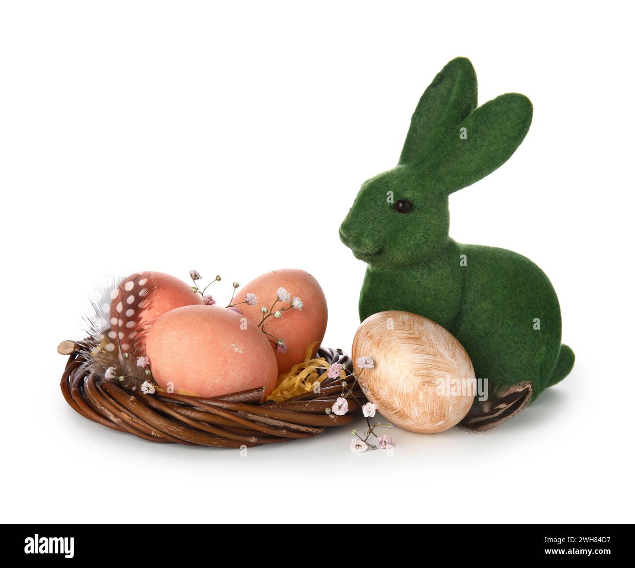 Easter eggs in nest and bunny on white background Stock Photo - Alamy