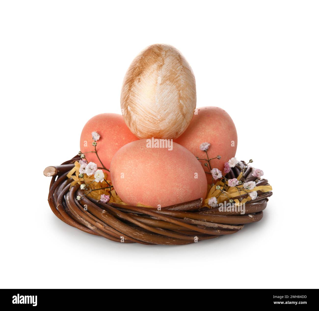Easter eggs in nest on white background Stock Photo - Alamy