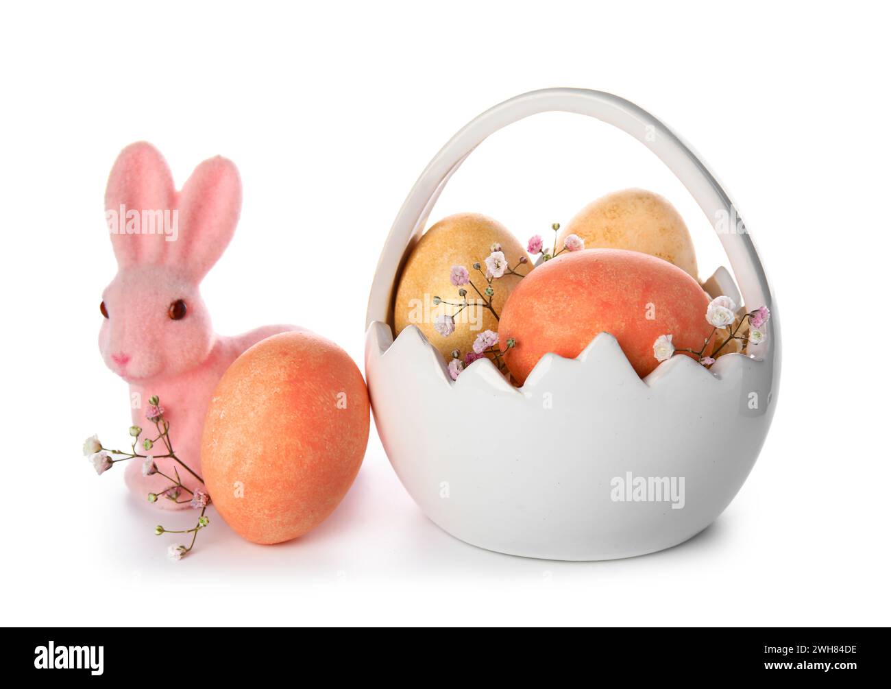 Ceramic basket of Easter eggs and pink bunny on white background Stock ...