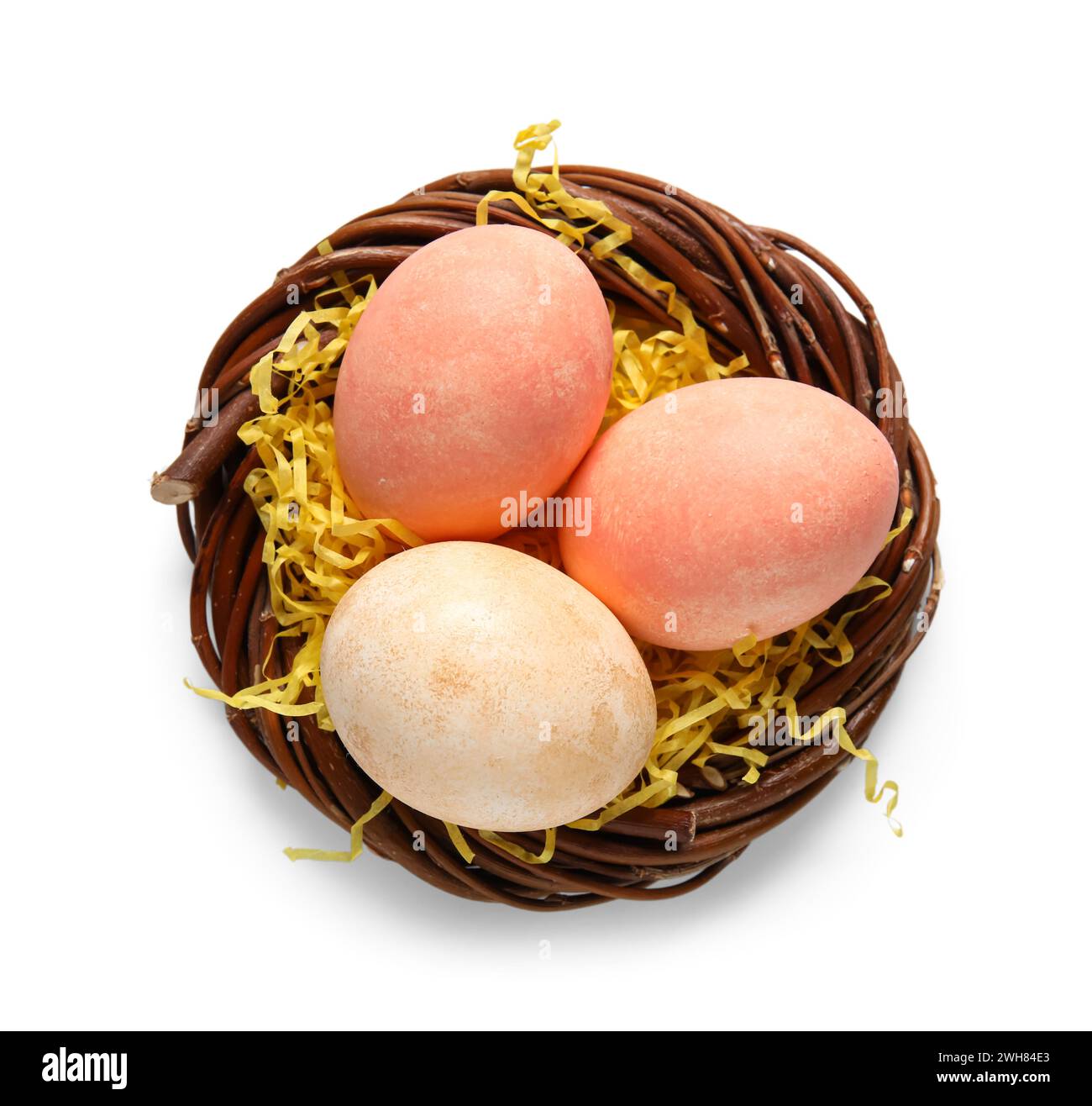 Easter eggs in nest on white background Stock Photo - Alamy