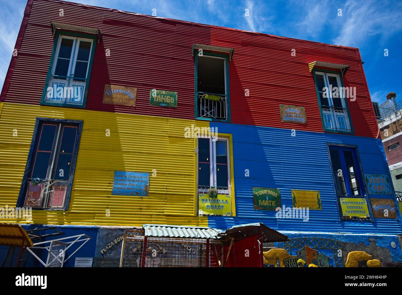 La Boca was largely abandoned untill in the 1950s when communal regeneration and local artist Benito Quinquela Martín began painting the tenements. Stock Photo