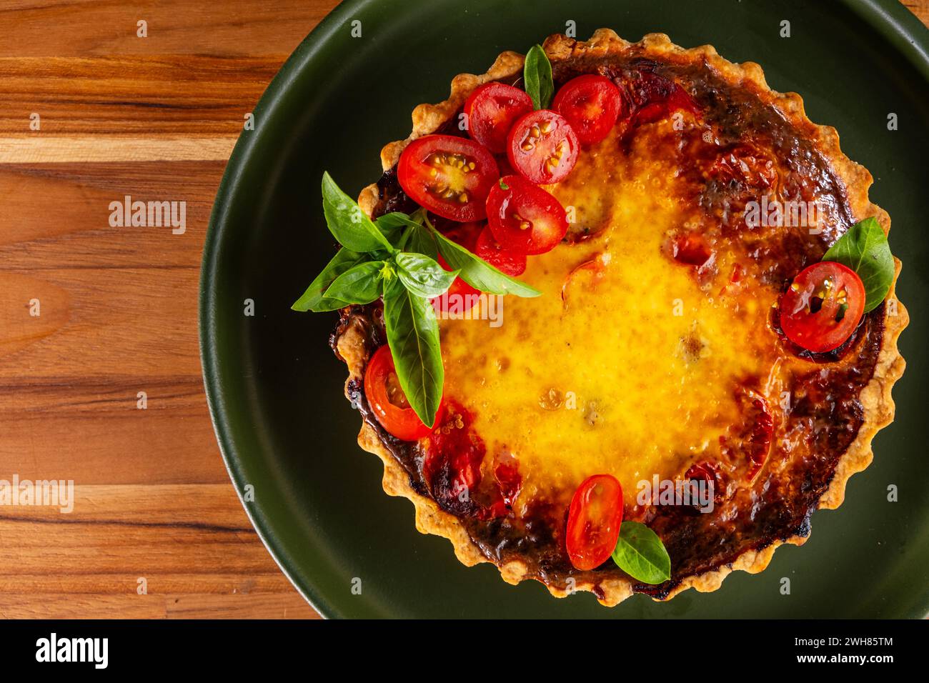 cheese and cherry tomato quiche. Stock Photo