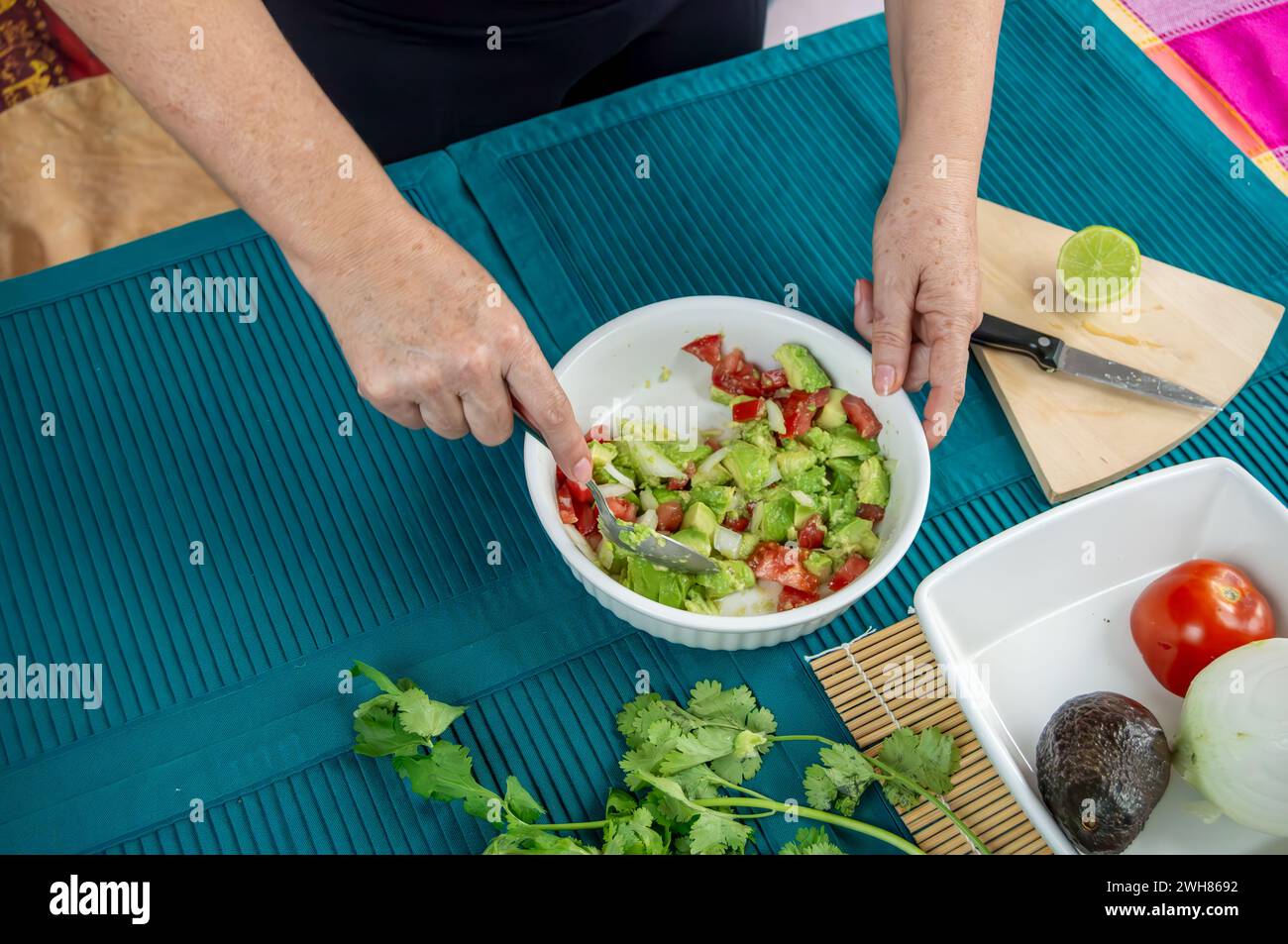 Hands Crafting Guacamole with Ripe Avocados. A series of images ...