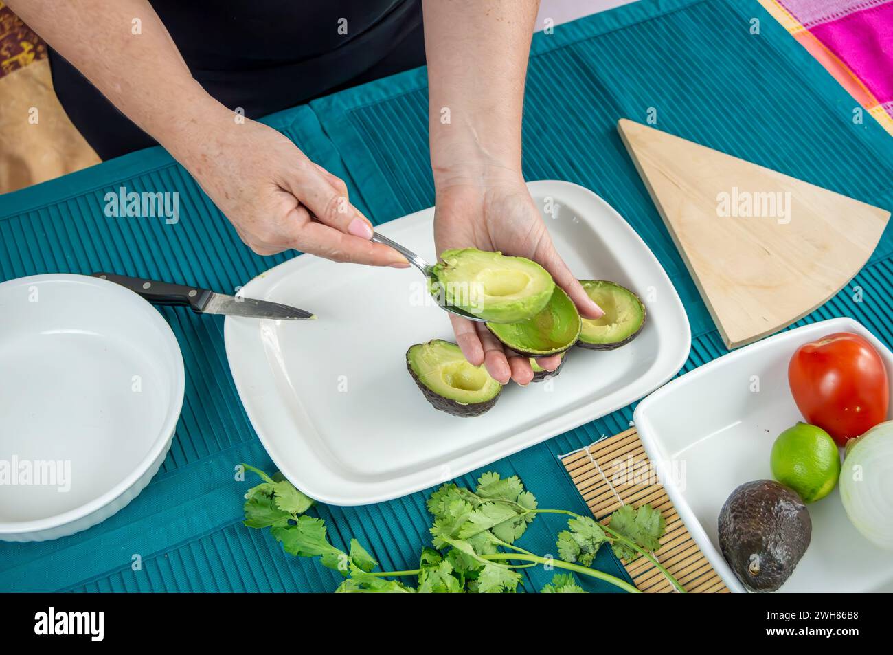 Hands Crafting Guacamole with Ripe Avocados. A series of images ...