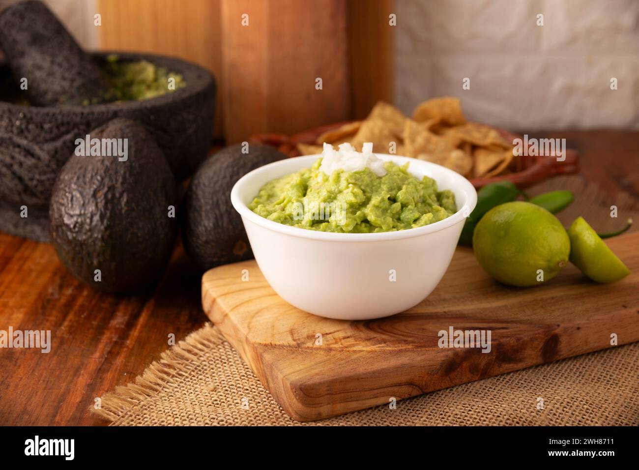 Guacamole. Avocado dip sauce, one of its many ways of consuming it is spread on tortilla chips also called Nachos. Mexican easy homemade sauce recipe Stock Photo