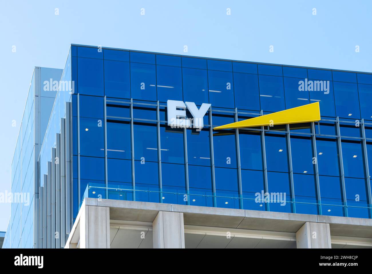 Auckland, New Zealand - January 30, 2024: Close-up of EY (Ernst and Young) logo sign on the building in Auckland, New Zealand. Stock Photo