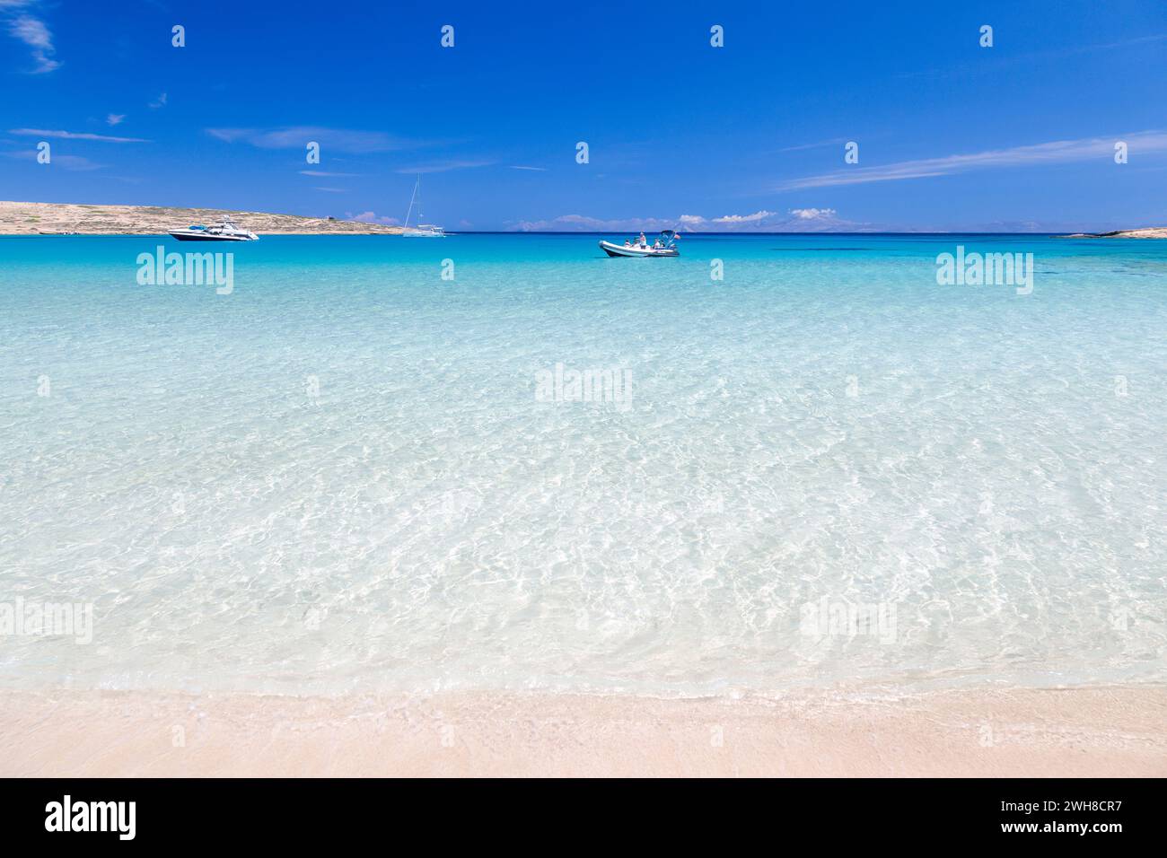 Dreamy sandy beach of crystal clear turquoise waters in Koufonisi island, Cyclades islands, Greece, Europe. Stock Photo