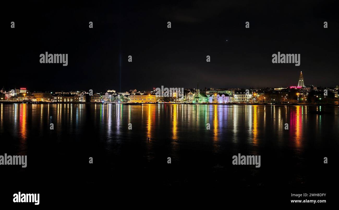 Vibrant urban cityscape at night with mesmerizing lights reflecting on ...