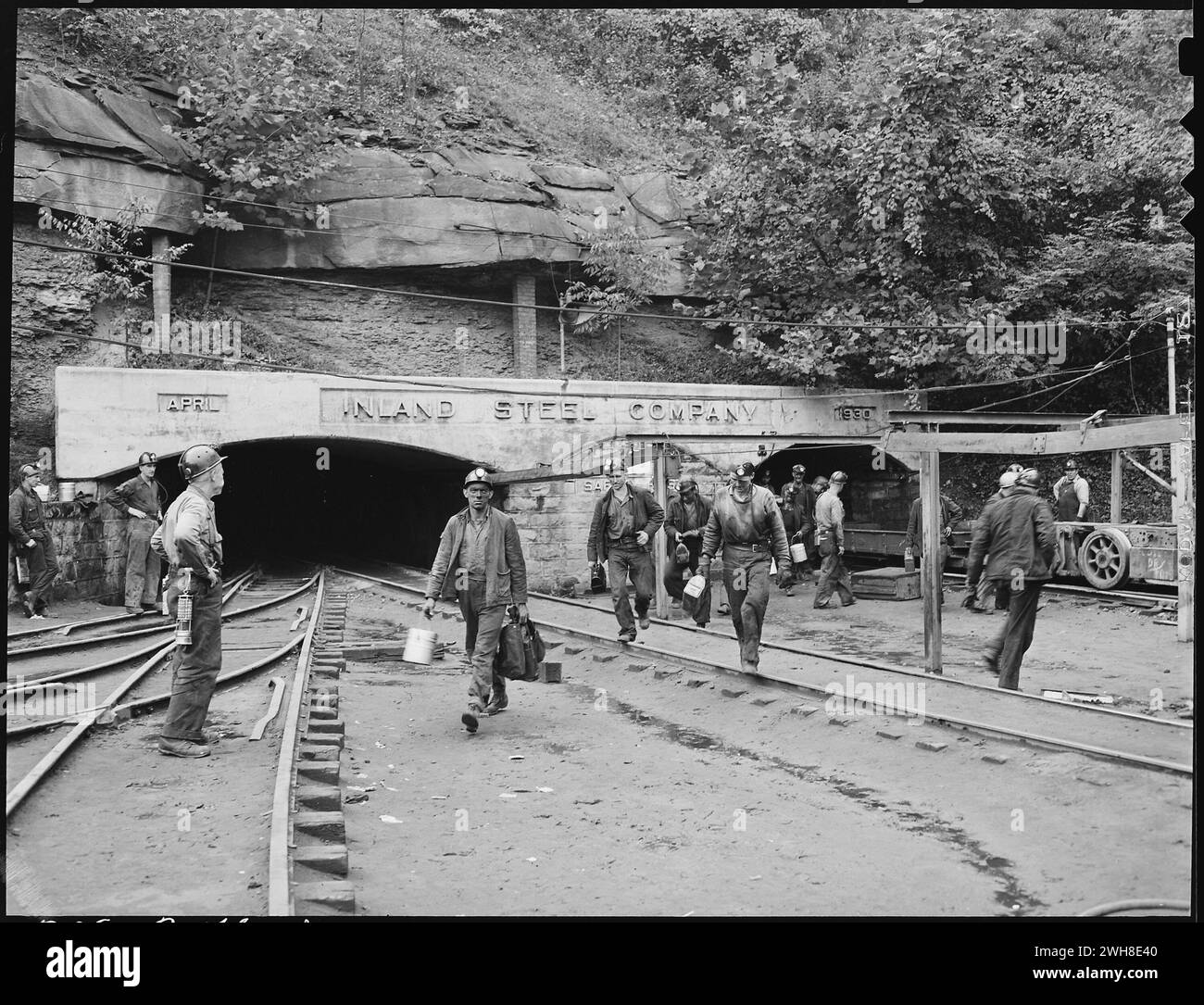 Changing shifts at the mine portal in the afternoon. Inland Steel Company, Wheelwright 1 & 2