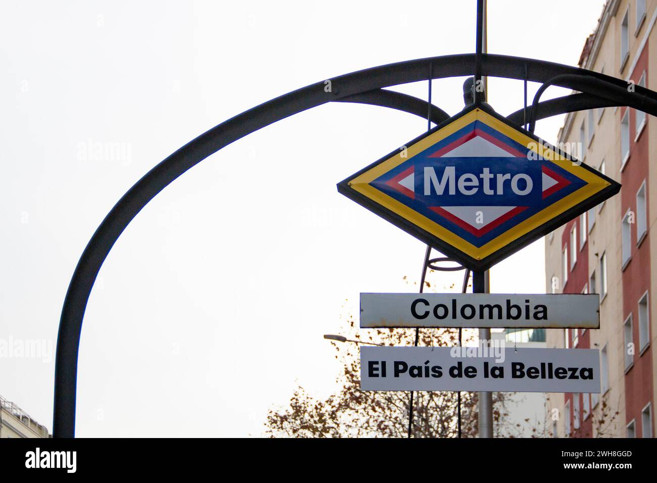 Metro station sign in Madrid, a station called 'Colombia' that has been painted with its flag Stock Photo
