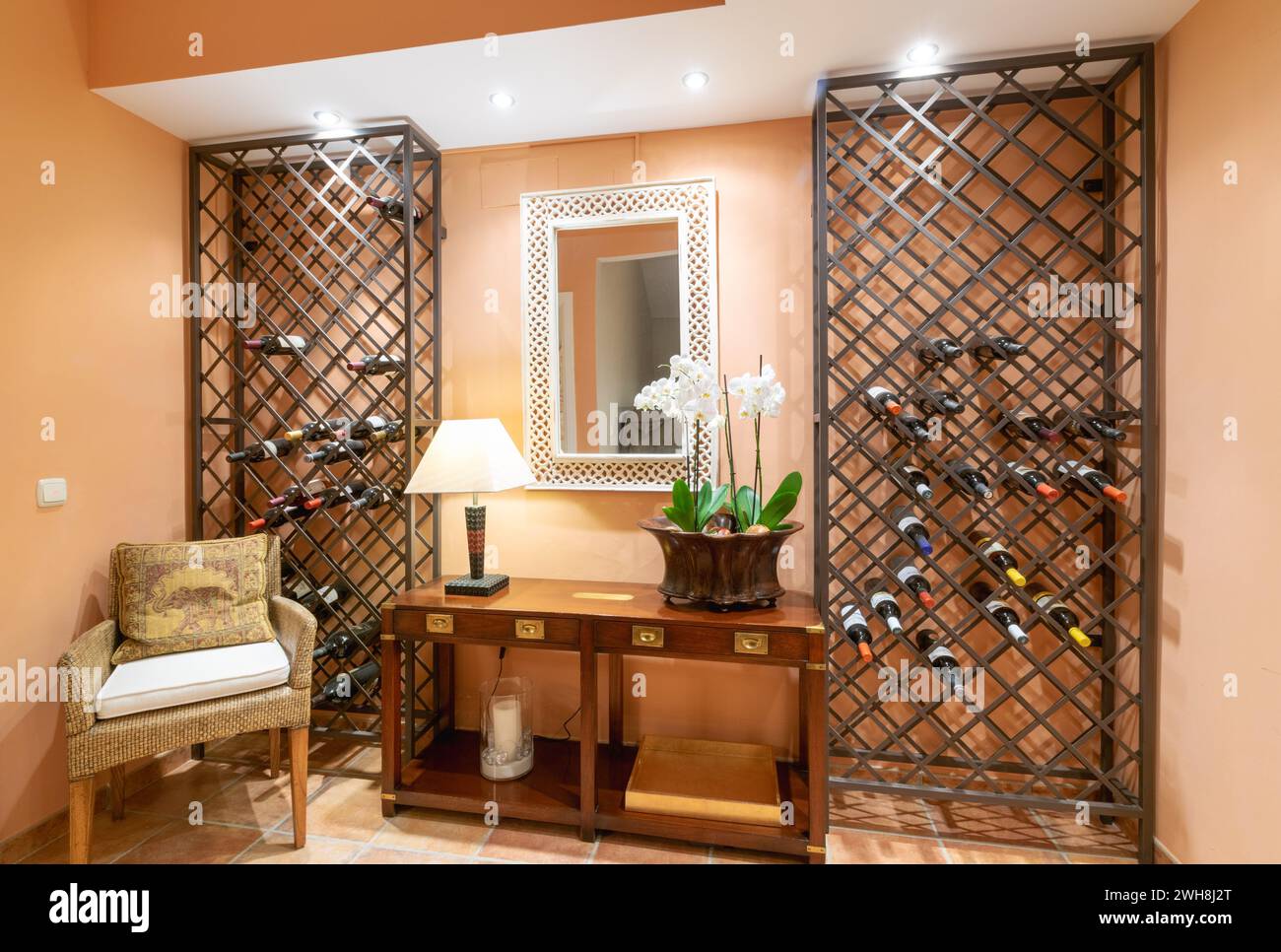 View of an amazing wall wine cabinet display inside luxury mediterranean villa ...