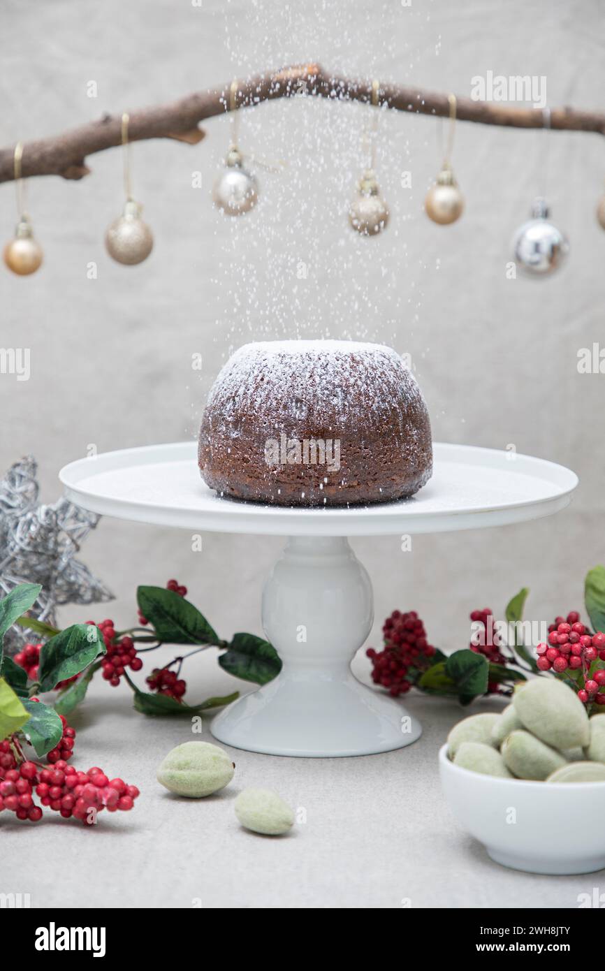 Christmas Plum Pudding dusted with sugar Stock Photo