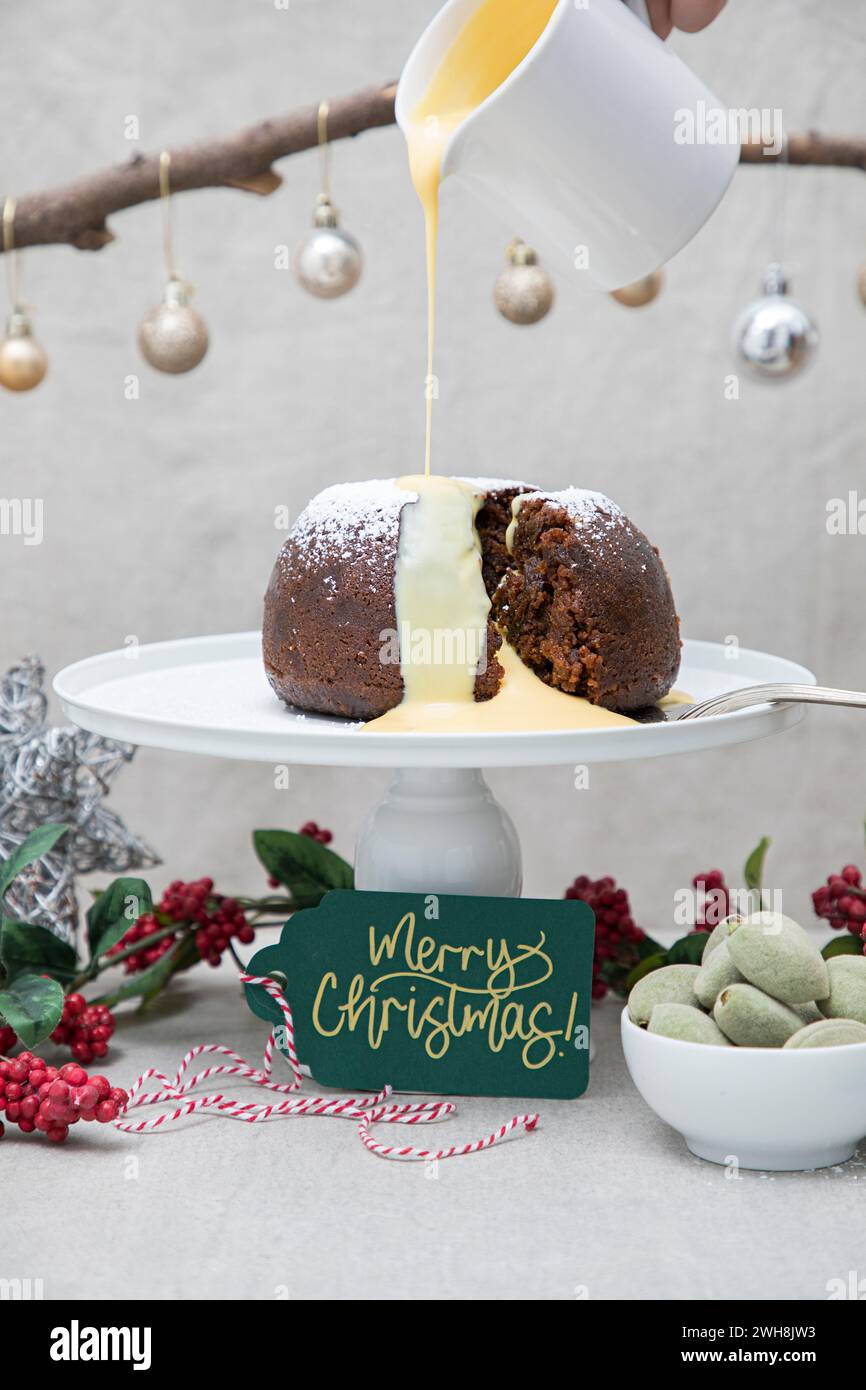 Christmas Plum Pudding with Custard Stock Photo