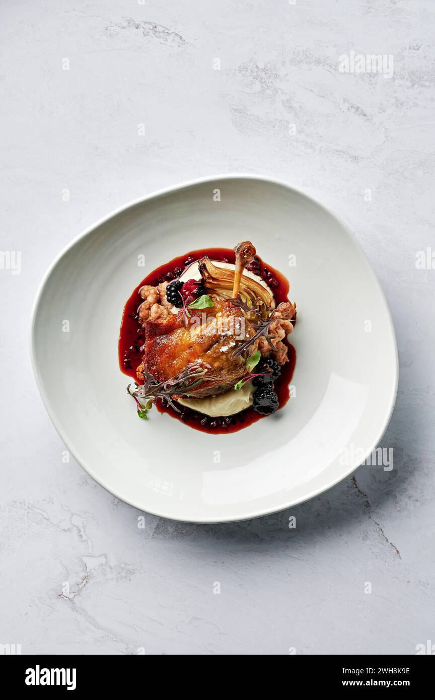 Roasted, confit duck leg, parsnip puree, spiced pork & fennel seed ...