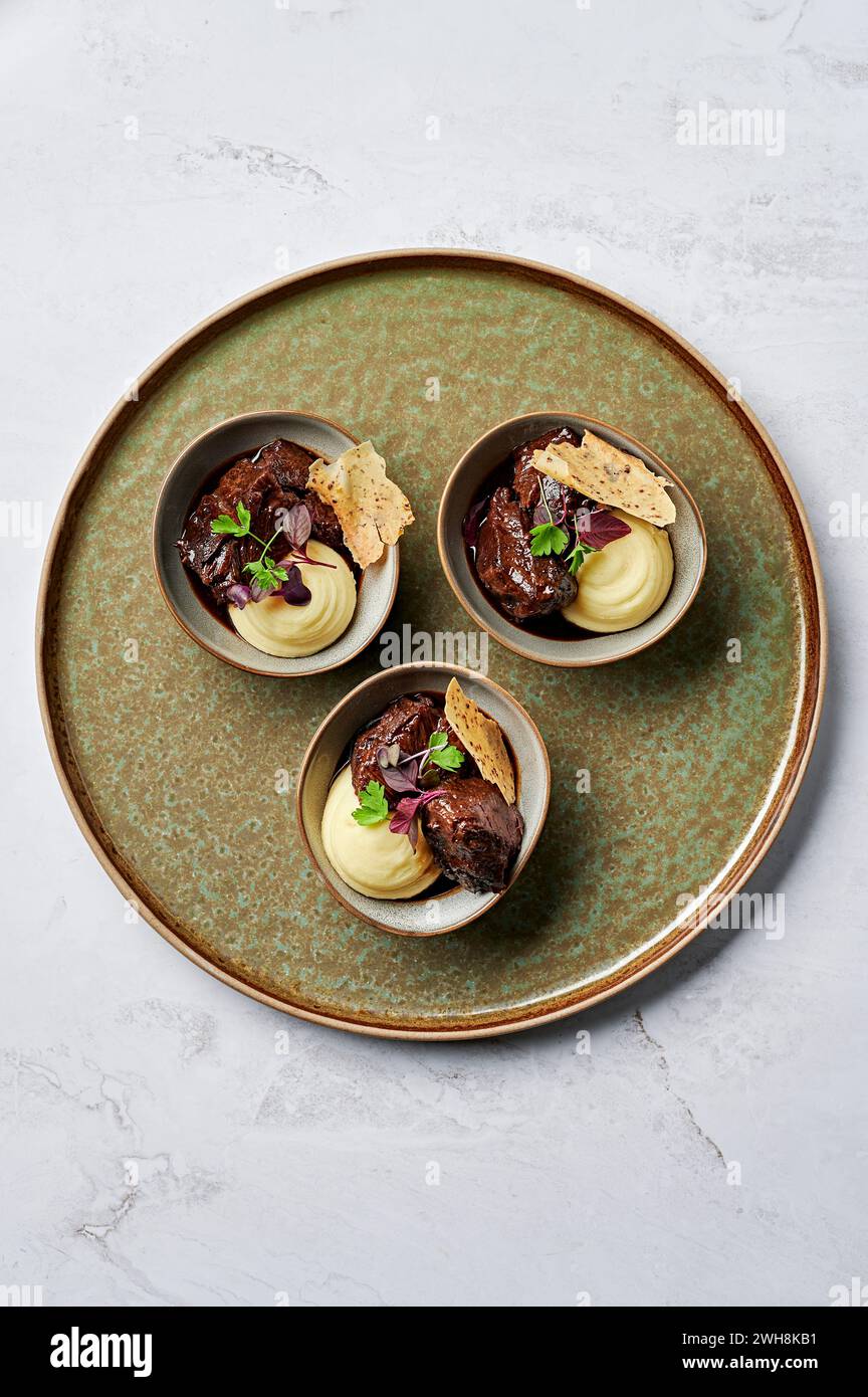 Slow cooked beef cheek, parsnip mash, red wine jus, seeded mustard